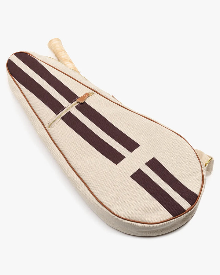 A canvas tennis racket cover in cream with dark brown stripes and a light brown leather strap, shown on a clean white background.